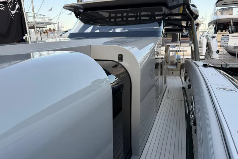 Slide: The Image of 2025 Midnight Express 52 Vitesse luxury yacht, sleek design, docked at marina. - 16