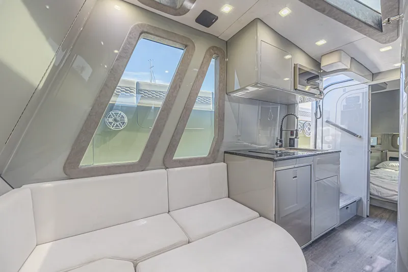 Slide: The Image of Luxurious interior of 2025 Midnight Express 52 Vitesse yacht with modern kitchen and seating. - 30