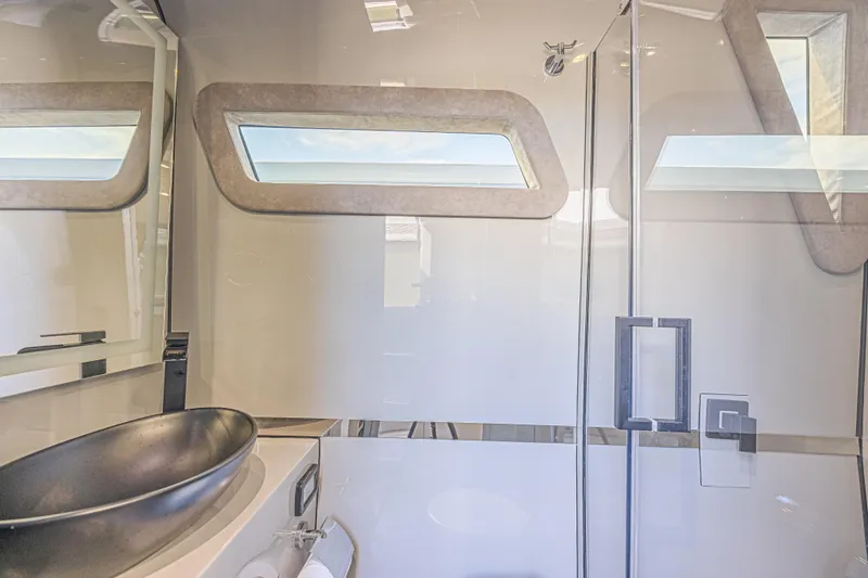Slide: The Image of Luxurious bathroom interior of 2025 Midnight Express 52 Vitesse yacht, featuring modern fixtures. - 33