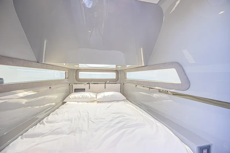 Slide: The Image of Luxurious cabin interior of 2025 Midnight Express 52 Vitesse yacht, featuring a cozy bed. - 34