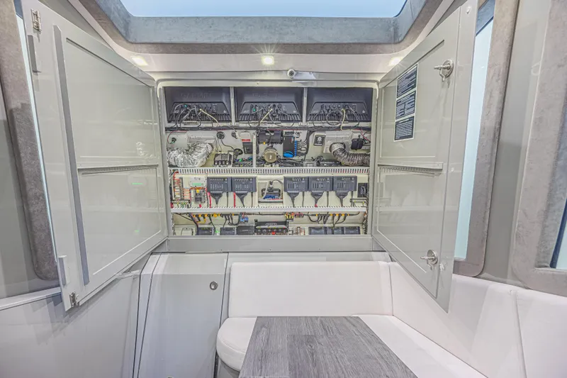 Slide: The Image of Electrical panel inside 2025 Midnight Express 52 Vitesse yacht, showcasing advanced wiring and components. - 36
