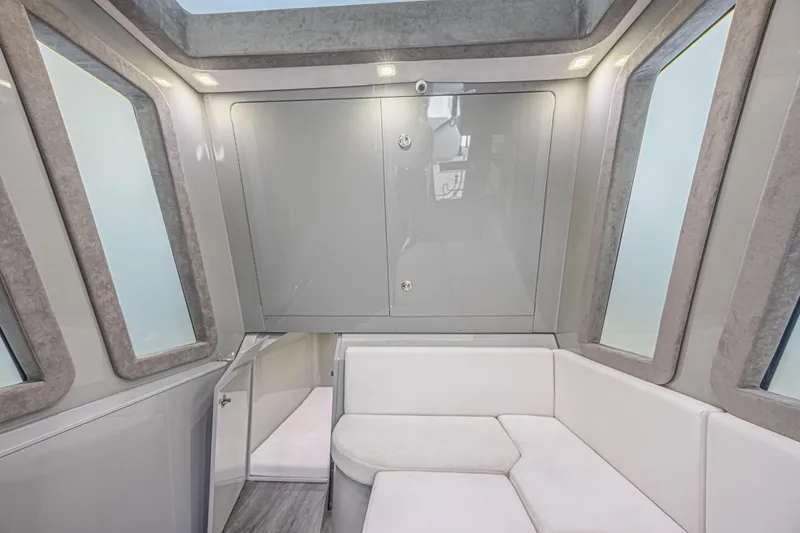 Slide: The Image of Luxurious interior of 2025 Midnight Express 52 Vitesse yacht with modern seating and windows. - 37