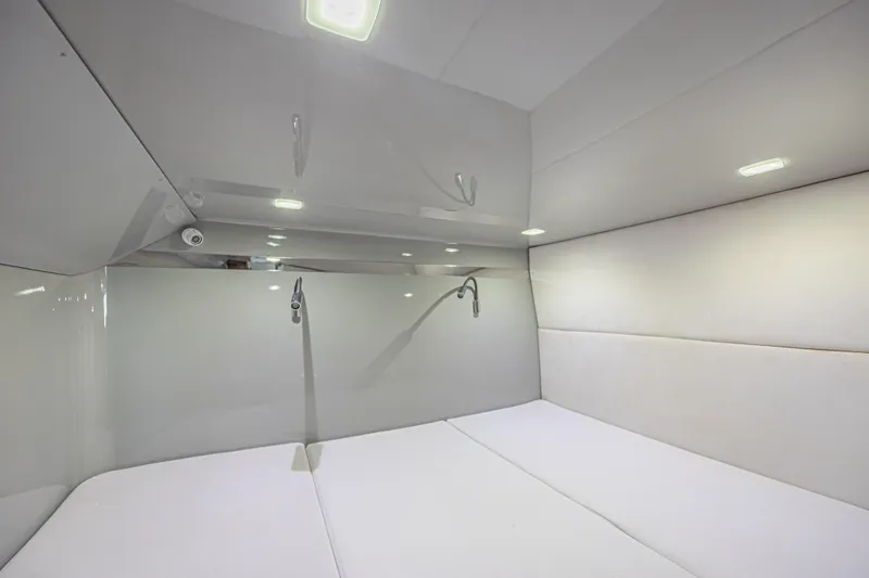 Slide: The Image of Luxurious interior cabin of 2025 Midnight Express 52 Vitesse yacht, featuring modern lighting. - 38