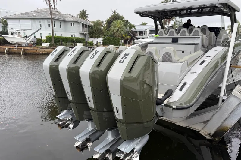 Slide: The Image of 2025 Midnight Express 52 Vitesse luxury boat docked, showcasing sleek seating and modern design. - 5