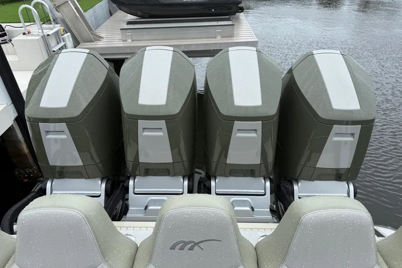 Slide: The Image of Luxury 2025 Midnight Express 52 Vitesse yacht docked at marina, showcasing sleek design. - 6