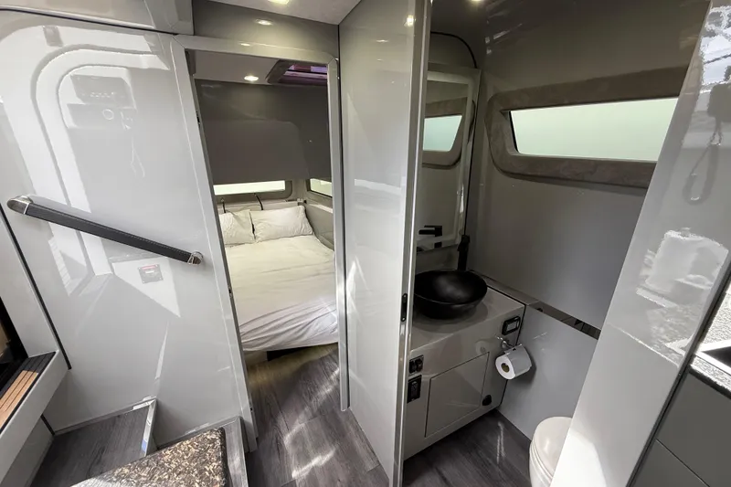 Slide: The Image of Luxurious 2025 Midnight Express 52 Vitesse yacht interior with seating and entertainment area. - 9