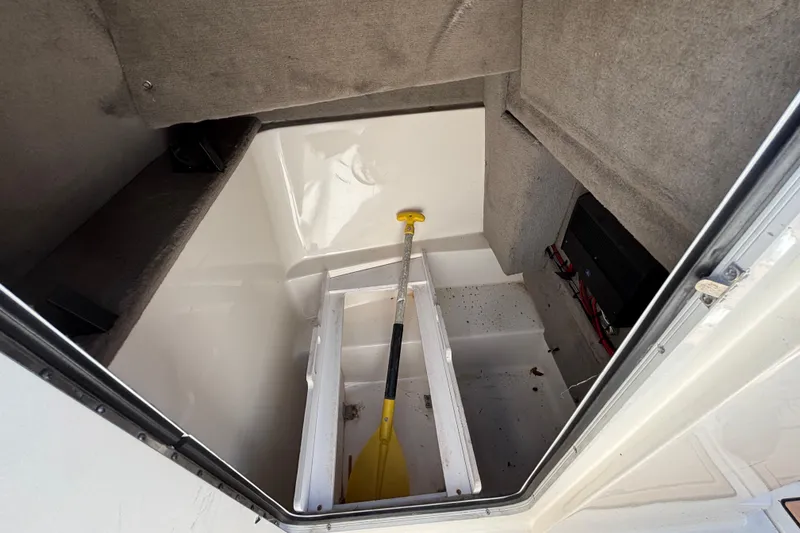 Slide: The Image of 2007 Sea Ray SLX 250 boat on trailer under bright blue sky. - 11