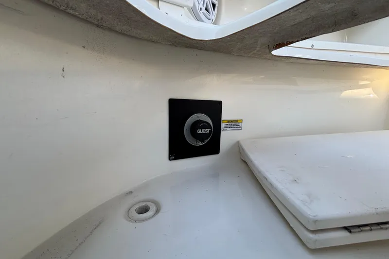 Slide: The Image of Interior of a 2007 Sea Ray SLX 250 boat with luxurious seating and wood accents. - 15