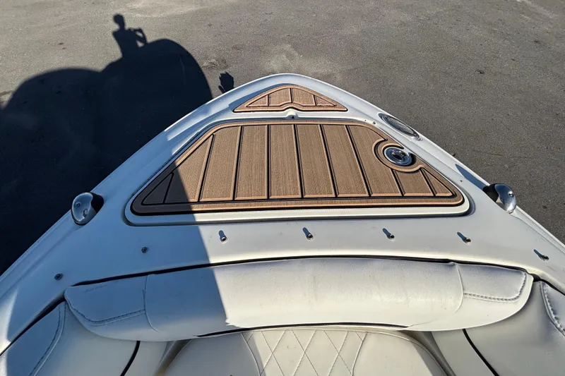 Slide: The Image of 2007 Sea Ray SLX 250 boat interior with storage compartment and speaker. - 30