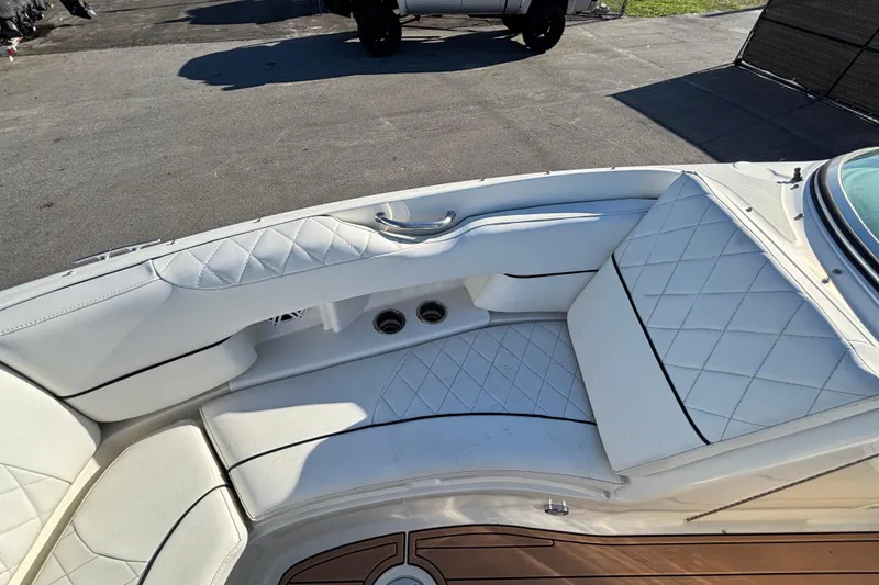 Slide: The Image of Interior view of a 2007 Sea Ray SLX 250 boat dashboard with controls and speaker. - 36