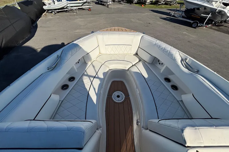 Slide: The Image of Storage compartment on a 2007 Sea Ray SLX 250 boat with teak flooring. - 38