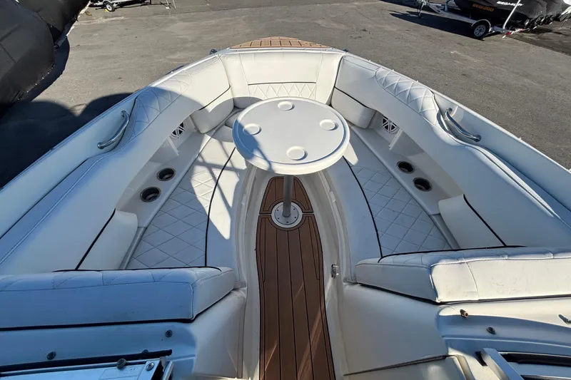 Slide: The Image of Interior of a 2007 Sea Ray SLX 250 boat with luxurious seating and wood flooring. - 39