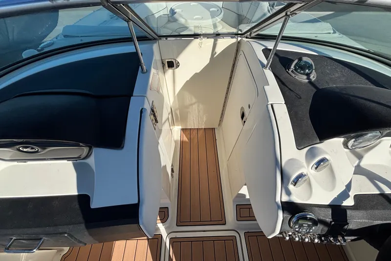 Slide: The Image of 2007 Sea Ray SLX 250 boat dashboard with steering wheel and windshield. - 40