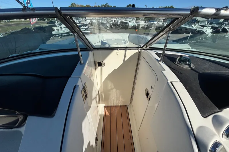 Slide: The Image of 2007 Sea Ray SLX 250 dashboard with Clarion audio system. - 42