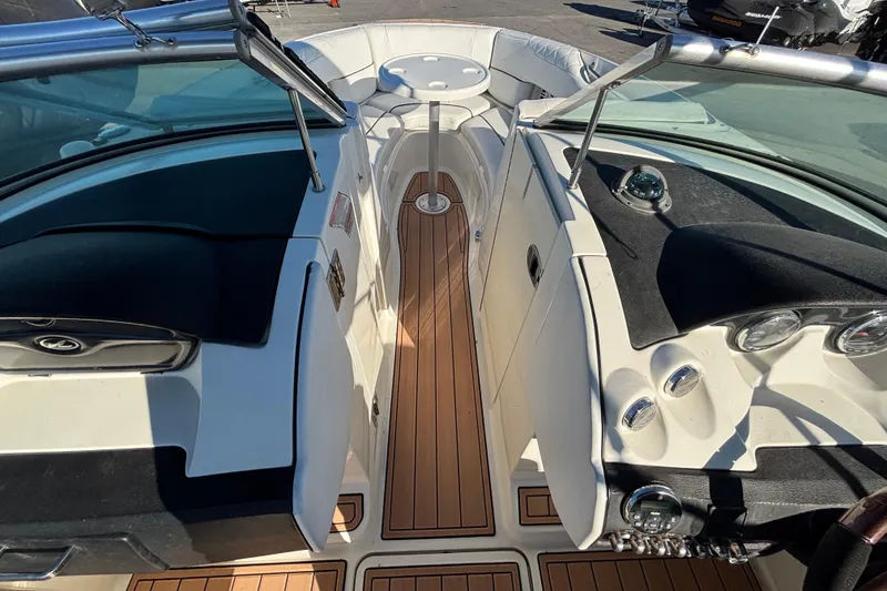 Slide: The Image of Interior view of 2007 Sea Ray SLX 250 boat cabin with seating and storage. - 45