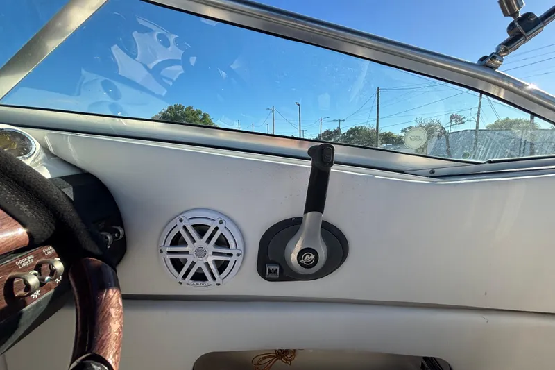 Slide: The Image of 2007 Sea Ray SLX 250 boat interior with compact marine toilet. - 46