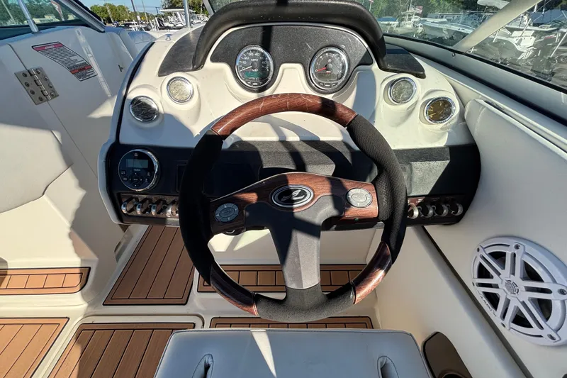 Slide: The Image of Open storage compartment on a 2007 Sea Ray SLX 250 boat, showing interior space. - 47