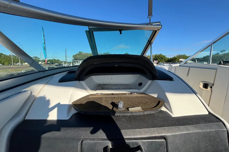 Slide: The Image of Interior view of a 2007 Sea Ray SLX 250 boat with wooden flooring. - 51