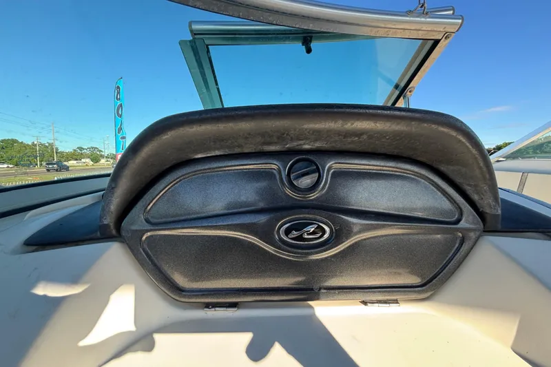 Slide: The Image of 2007 Sea Ray SLX 250 boat interior with windshield and wooden flooring. - 52