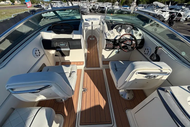 Slide: The Image of White leather seating on a 2007 Sea Ray SLX 250 boat. - 57
