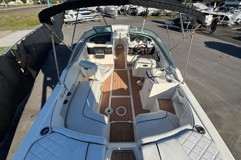 Slide: The Image of Bow of 2007 Sea Ray SLX 250 boat with teak decking and white upholstery. - 59