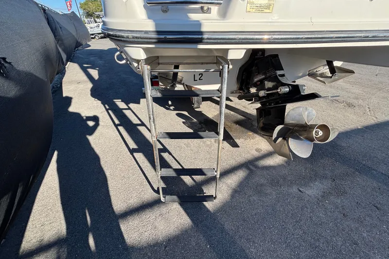 Slide: The Image of Interior view of a 2007 Sea Ray SLX 250 boat, featuring seating and speaker. - 62