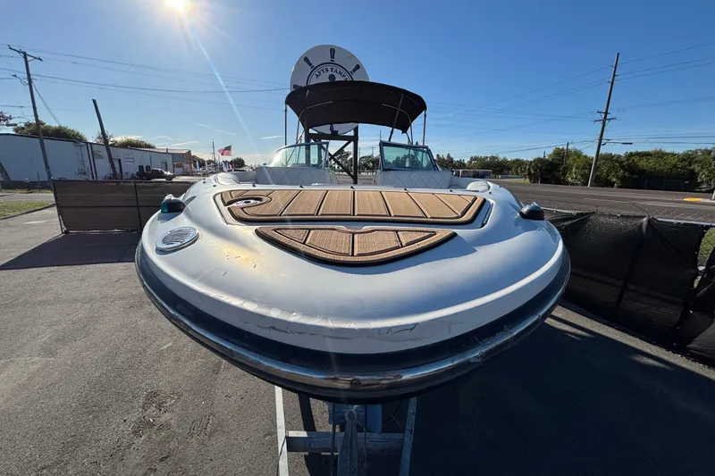 Slide: The Image of Rear view of 2007 Sea Ray SLX 250 boat with ladder and propeller. - 63