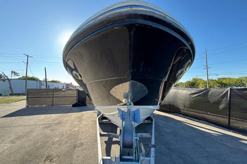 Slide: The Image of Trailer wheels of a 2007 Sea Ray SLX 250 boat on pavement. - 65