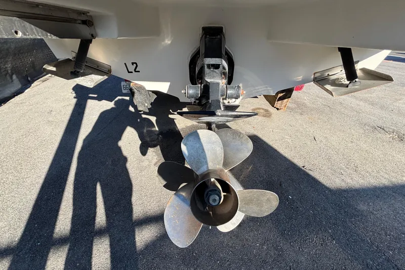 Slide: The Image of 2007 Sea Ray SLX 250 boat interior with white seating and round table. - 70