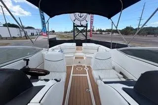 Slide: The Image of 2007 Sea Ray SLX 250 boat interior with white seating and wooden deck. - 78