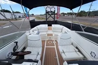 Slide: The Image of 2007 Sea Ray SLX 250 boat interior with white seating and wood accents. - 79