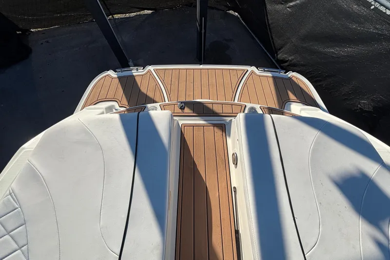 Slide: The Image of 2007 Sea Ray SLX 250 boat on trailer under bright sun. - 8