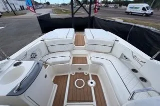 Slide: The Image of 2007 Sea Ray SLX 250 boat interior with white seating and wood accents. - 82