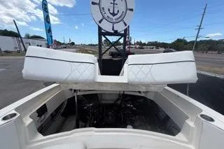 Slide: The Image of 2007 Sea Ray SLX 250 boat engine compartment with open hatch, outdoor setting. - 92