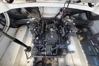 Slide: The Image of Engine compartment of a 2007 Sea Ray SLX 250 boat, showcasing mechanical components. - 93