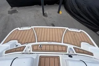 Slide: The Image of 2007 Sea Ray SLX 250 boat deck with teak flooring, viewed from above. - 96