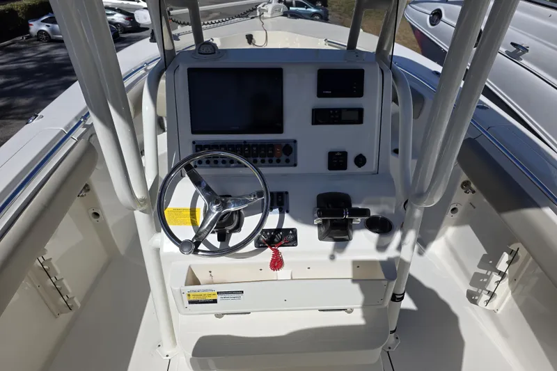 Slide: The Image of Center console of 2021 Key West 244 boat with steering wheel and controls. - 10