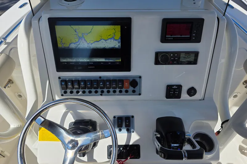 Slide: The Image of Center console of 2021 Key West 244 boat with navigation and control systems. - 11