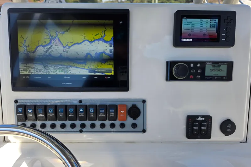 Slide: The Image of Dashboard of 2021 Key West 244 Center Console with navigation and control systems. - 12