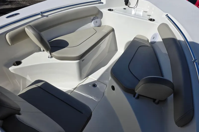 Slide: The Image of 2021 Key West 244 Center Console boat interior with cushioned seating and cup holders. - 16