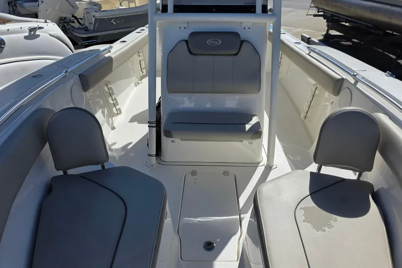 Slide: The Image of 2021 Key West 244 Center Console boat interior with seating and storage compartments. - 17