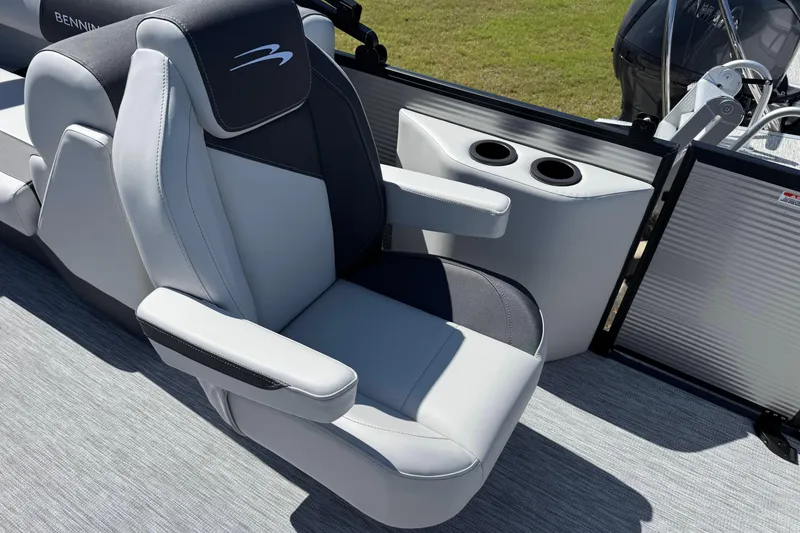 Slide: The Image of 2026 Bennington 22 SSR boat seat with armrests and cup holders, showcasing luxury design. - 10