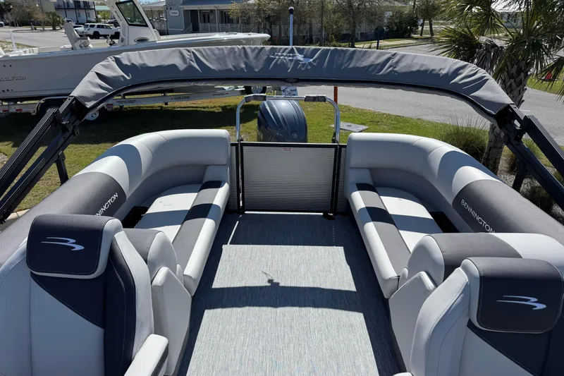 Slide: The Image of 2026 Bennington 22 SSR pontoon boat interior with plush seating and canopy. - 11
