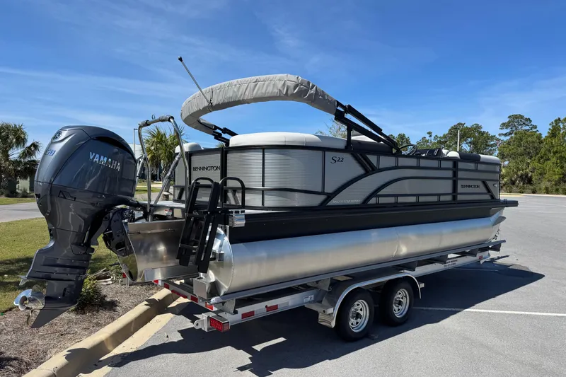 Slide: The Image of 2026 Bennington 22 SSR pontoon boat on trailer with Yamaha outboard motor. - 3