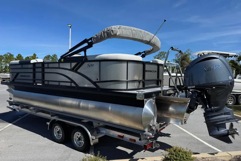 Slide: The Image of 2026 Bennington 22 SSR pontoon boat on trailer with Yamaha outboard motor. - 5