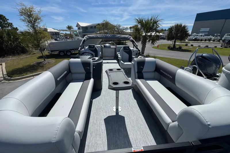 Slide: The Image of 2026 Bennington 22 SSR pontoon boat with spacious seating and modern design. - 7