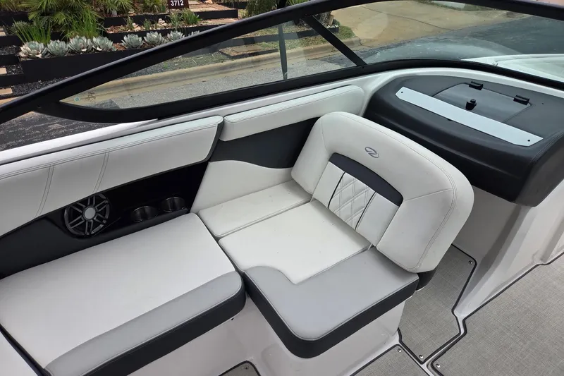 Slide: The Image of 2022 Regal 2000 ES Bowrider interior with white seating and speaker system. - 5
