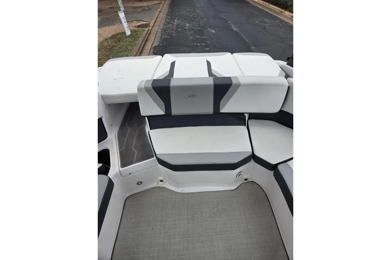 Slide: The Image of 2022 Regal 2000 ES Bowrider interior seating, featuring modern white and gray upholstery. - 7