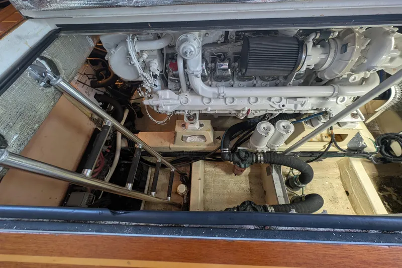 Slide: The Image of Engine compartment of a 1998 Little Harbor WhisperJet 55 yacht, showcasing mechanical components. - 11