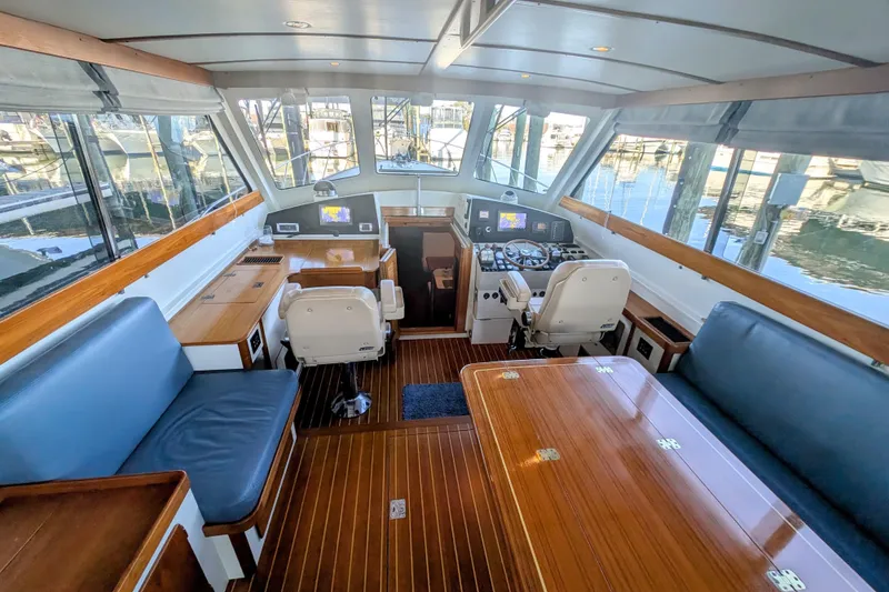 Slide: The Image of Luxurious interior of 1998 Little Harbor WhisperJet 55 yacht with wooden accents and seating. - 12